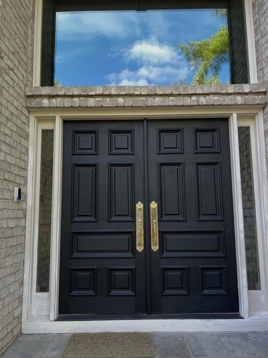 Lacquered double doors with brass hardware
